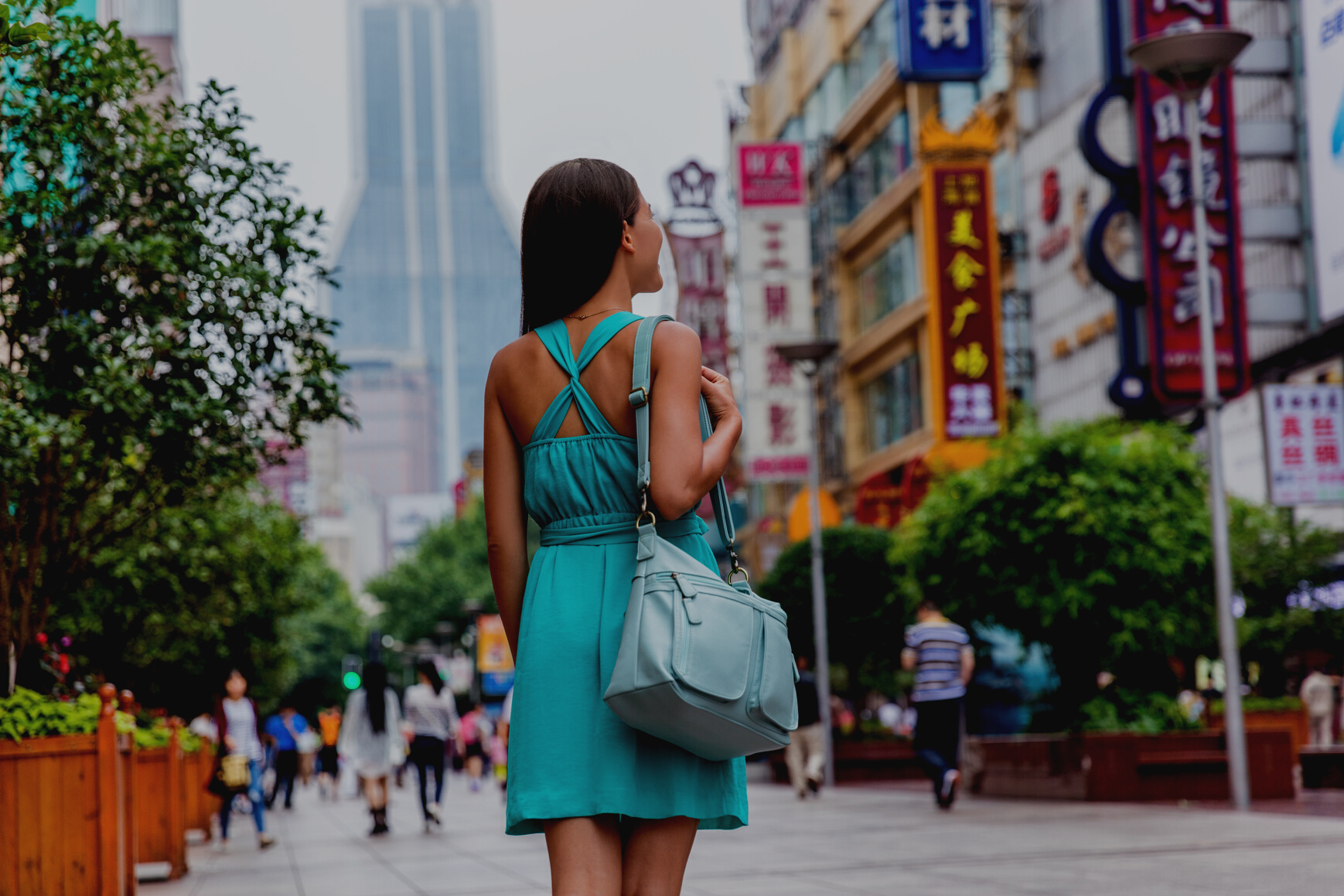 Girl Walking on Shopping Street in Shanghai